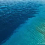 Home 4 해양의 해수면 상승 - **Prompt:** A visually stunning and serene, expansive deep blue ocean absorbing warmth. The surface ...